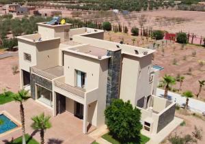an aerial view of a house with a swimming pool at Villa with Private Pool in Marrakech - Dar Mazar in Oubadine