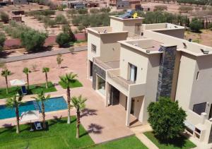 an aerial view of a house with a swimming pool at Villa with Private Pool in Marrakech - Dar Mazar in Oubadine