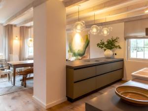 a kitchen with a island and a dining room at N3 Quartier in Kall