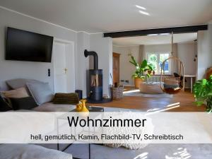 a living room with a couch and a fireplace at N3 Quartier in Kall +34 photos