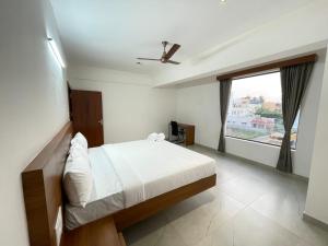 Ένα ή περισσότερα κρεβάτια σε δωμάτιο στο KK Service