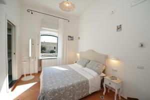 Ένα ή περισσότερα κρεβάτια σε δωμάτιο στο La Cascata