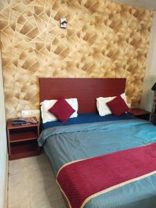 Postel nebo postele na pokoji v ubytování Hotel Shivaye Residency