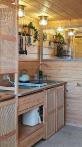 a kitchen with a sink and a counter top at Alemiło mini - domek z balią i widokiem na Babią Górę in Zawoja