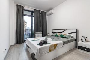 Ένα ή περισσότερα κρεβάτια σε δωμάτιο στο Mladost Mountain View One Bedroom Apartment