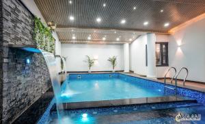 a swimming pool in a room with a swimming pool at Avaani Residency in Jalandhar