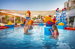 two children playing in the water at a pool at Valamar Meteor Hotel in Makarska +53 photos