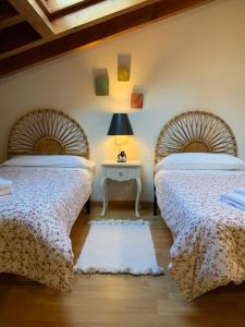 Giường trong phòng chung tại La plaza de llanes, Plaza Parres Sobrino, 6