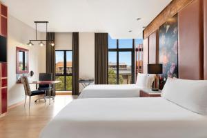 Postel nebo postele na pokoji v ubytování African Pride Melrose Arch, Autograph Collection + 113 fotografií