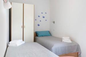 Ένα ή περισσότερα κρεβάτια σε δωμάτιο στο Appartamento Verde-Blu