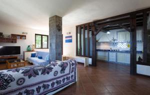 a living room with a couch and a kitchen at Villa Mare Panoramica Estia in Brancaleone Marina