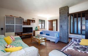a living room with two couches and a tv at Villa Mare Panoramica Estia in Brancaleone Marina
