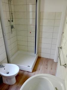 a bathroom with a shower and a sink and a toilet at Il Borgo in Iglesias