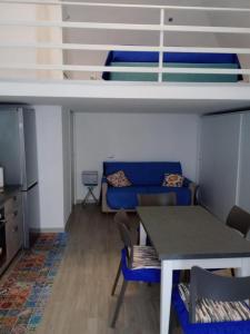 a living room with a couch and a table at La Perla del Borgo in Vieste