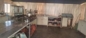 a kitchen with a stove and a counter top at Siman luxury camp in Merzouga +6 photos