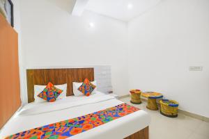 Postel nebo postele na pokoji v ubytování FabHotel Rajhans + 19 fotografií