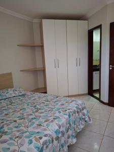 a bedroom with a bed and white cabinets at Ocean View tabatinga residence in Nísia Floresta +28 photos