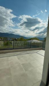 a balcony with a view of a roof at Villa Saguramo in Saguramo
