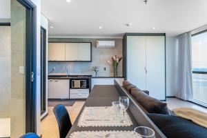 a living room with a couch and a table at BHS Flat a beira mar 2203 in Recife