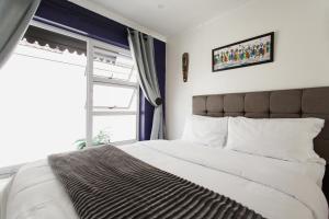 Ένα ή περισσότερα κρεβάτια σε δωμάτιο στο Caline VIP Luxury Jacuzzi &, Swimming Pool MEWS