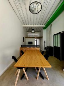 a large wooden table in a room with chairs at Casa Patio del Vino in Ciudad-Rodrigo