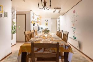a dining room with a table and chairs at Ainola Arctic Hillside in Rovaniemi
