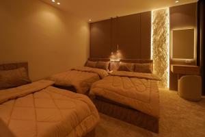 Ένα ή περισσότερα κρεβάτια σε δωμάτιο στο Sydney Downtown Cairo Hotel