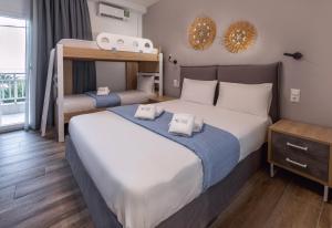 a bedroom with two beds and a bunk bed at Azzurro in Nei Poroi