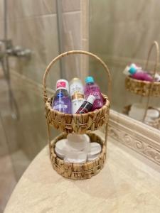 a basket of toiletries on a counter in a bathroom at Coral Bay Studio Varna - Beachfront with Free Parking in Varna City