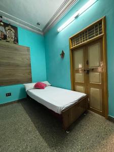 Ένα ή περισσότερα κρεβάτια σε δωμάτιο στο NPS Homestay