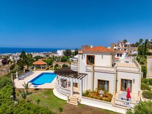 an aerial view of a villa with a swimming pool at Sunset Poseidon by Carrington in Kyrenia