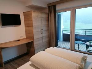 Ένα ή περισσότερα κρεβάτια σε δωμάτιο στο Apartment Lärche - DeLuxe