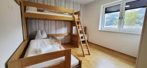 Postel nebo postele na pokoji v ubytování LandLiebe Aich by Alpenidyll Apartments + 9 fotografií