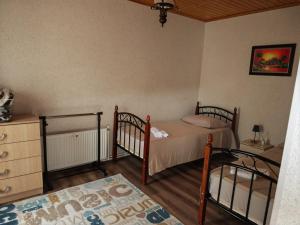 a bedroom with two twin beds and a dresser at Zeyvə Farm House 