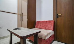 Ένα ή περισσότερα κρεβάτια σε δωμάτιο στο FabHotel Elite Residency