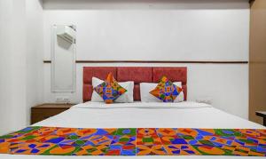 Ένα ή περισσότερα κρεβάτια σε δωμάτιο στο FabHotel Elite Residency +17 φωτογραφίες