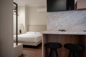 Ένα ή περισσότερα κρεβάτια σε δωμάτιο στο Royar Casa del Reloj - Exclusivo Edificio de Apartamentos Catedral +45 φωτογραφίες