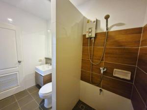 a bathroom with a toilet and a sink at Baan Khaoyai by Chateau in Ban Tha Maprang +15 photos