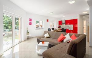 a living room with a couch and a kitchen at Villa Roberta by Villas Guide in Pazin
