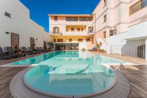 a swimming pool in the middle of a building at Cristal Blu in Santa Teresa Gallura