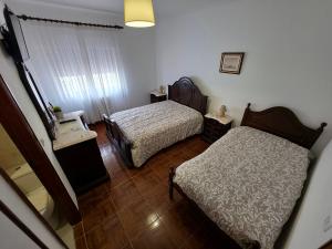 Cama o camas de una habitación en Alojamentos Altamira