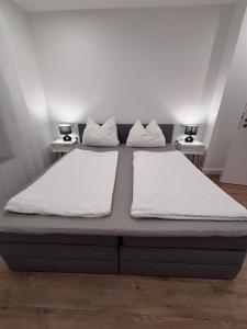 Postel nebo postele na pokoji v ubytování Heide-deluxe