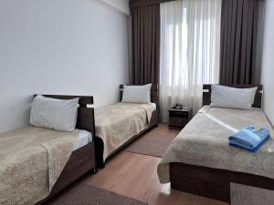 Postel nebo postele na pokoji v ubytování A-Hotel Ex Magistral