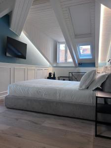 Ένα ή περισσότερα κρεβάτια σε δωμάτιο στο Q suites urban relais