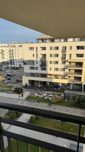 a view of a parking lot with a large building at VENUS Studios at Coresi Mall in Braşov