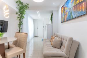 a living room with a couch and a table at Place Beira Mar in Recife
