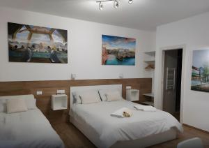 Ένα ή περισσότερα κρεβάτια σε δωμάτιο στο Platinum - Il Centro Luxury Suites