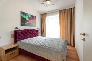 Ένα ή περισσότερα κρεβάτια σε δωμάτιο στο Luna Et Sol Apartments