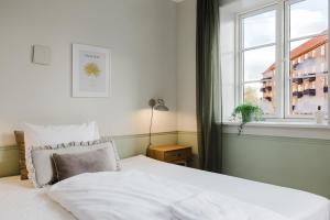 Ένα ή περισσότερα κρεβάτια σε δωμάτιο στο Upscale 3BR Apartment in City Center +12 φωτογραφίες