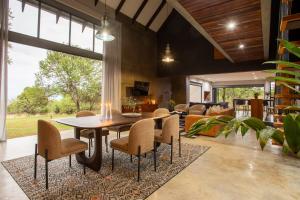 a dining room with a table and chairs at House Nyala in Lydenburg